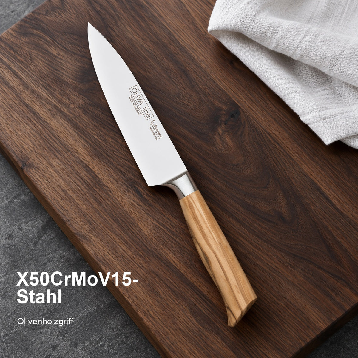 Kochmesser Oliva – X50CrMoV15-Stahl; Olivenholzgriff. Vorhandenes Bild aus der Hero-Sektion mit Materialangabe.