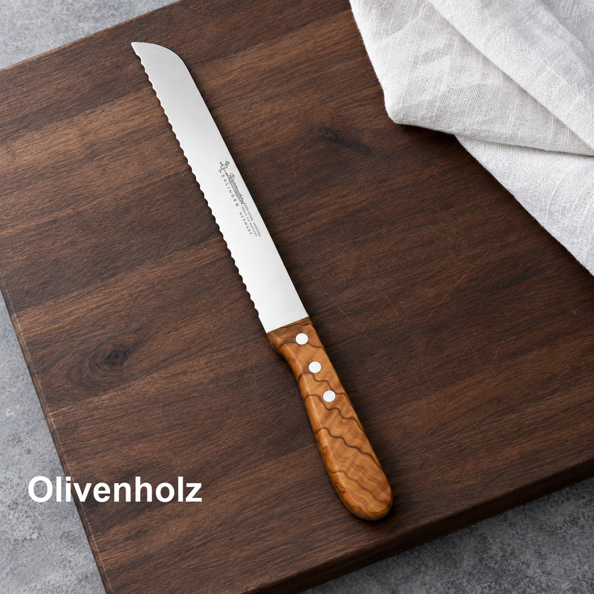 Brotmesser Olivenholz 20 cm – Olivenholzgriff. Vorhandenes Bild aus der Hero-Sektion mit Materialangabe.